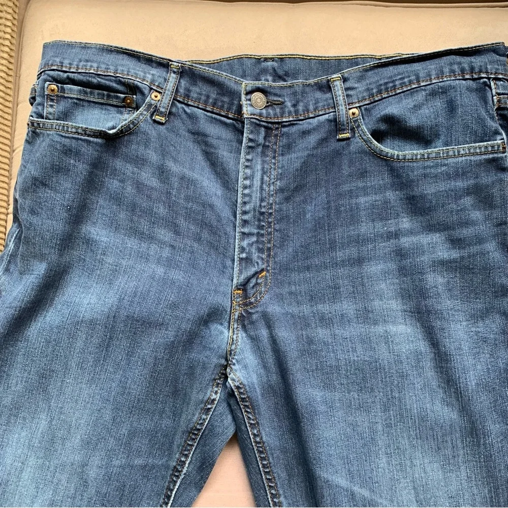 LEVIS.‎ Jeans, five pockets. Fraying on hem, and distressed W38/L34. Zipp…